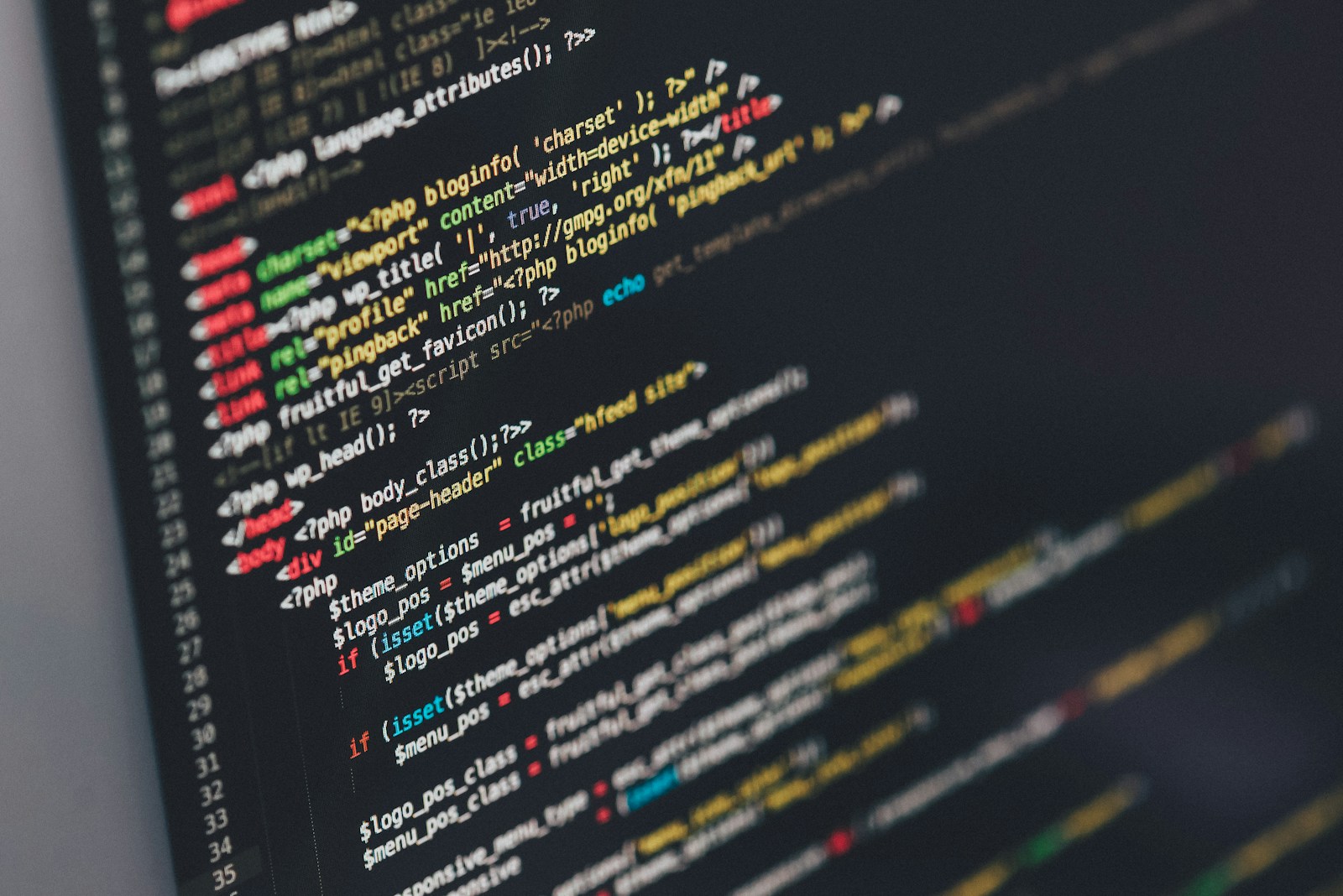 Engineer writing automated test code on a large display