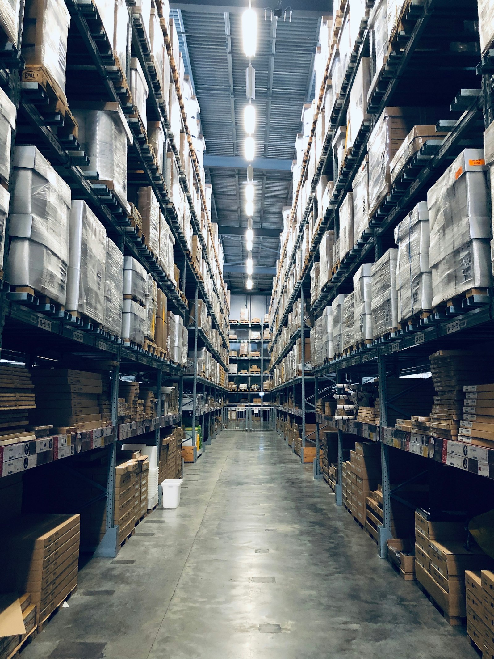 Warehouse aisle with racked inventory ready for automated handling