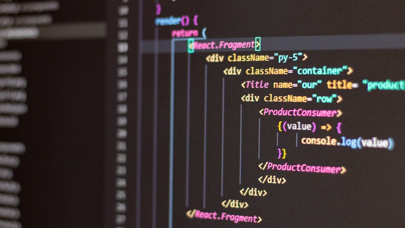 Engineer writing automated test code on a large display