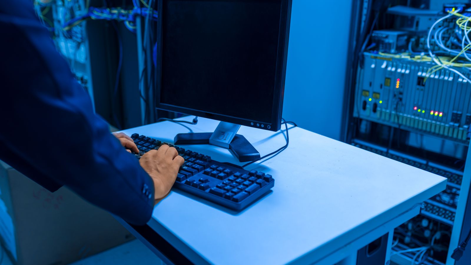 Cloud engineers working beside a data centre