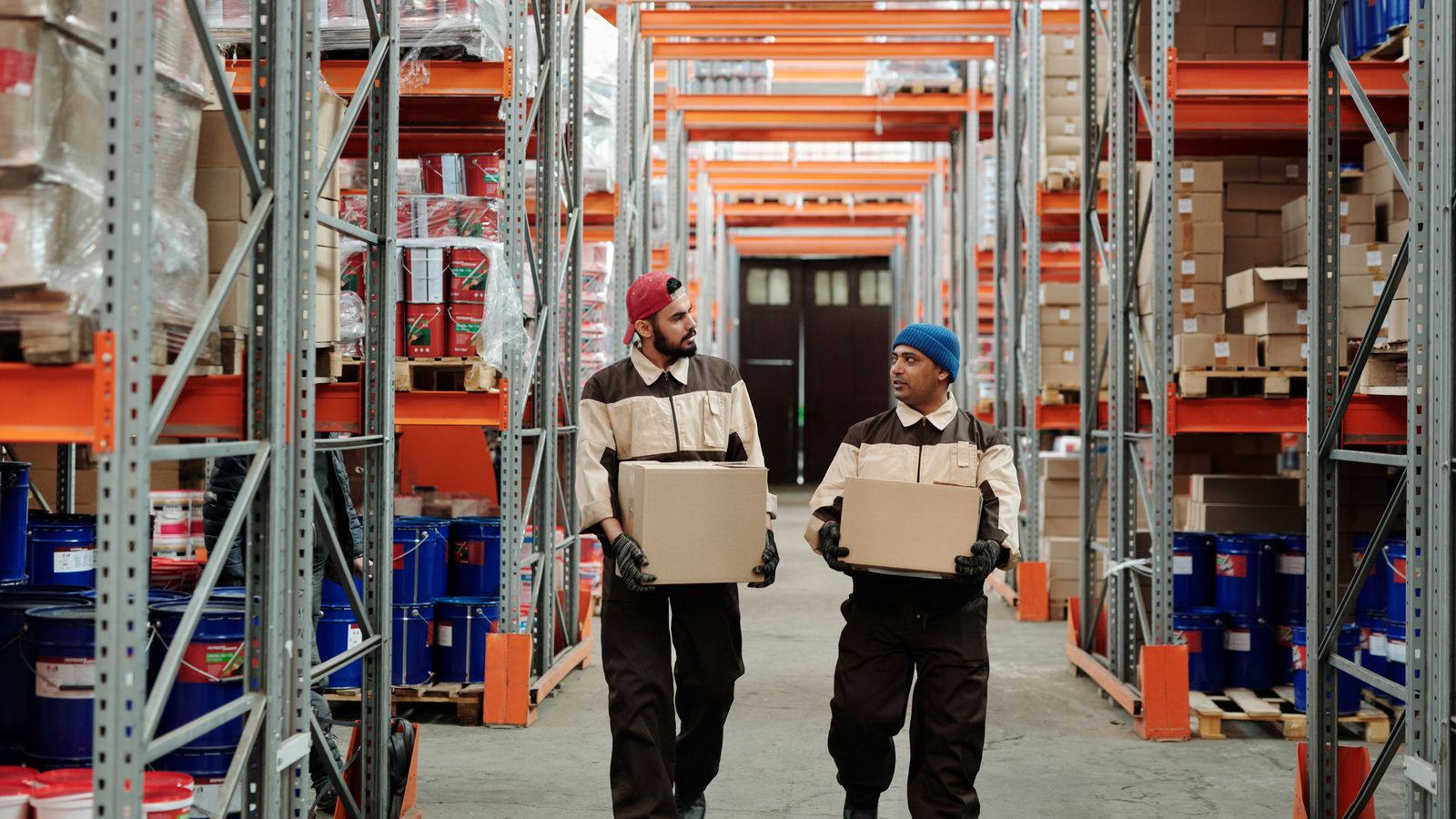 Supervisor using a tablet in an automated warehouse
